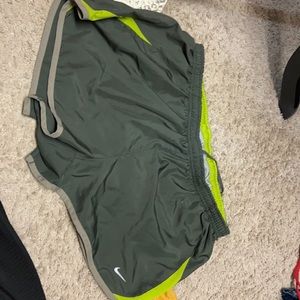 Grey and yellow Nike running shorts